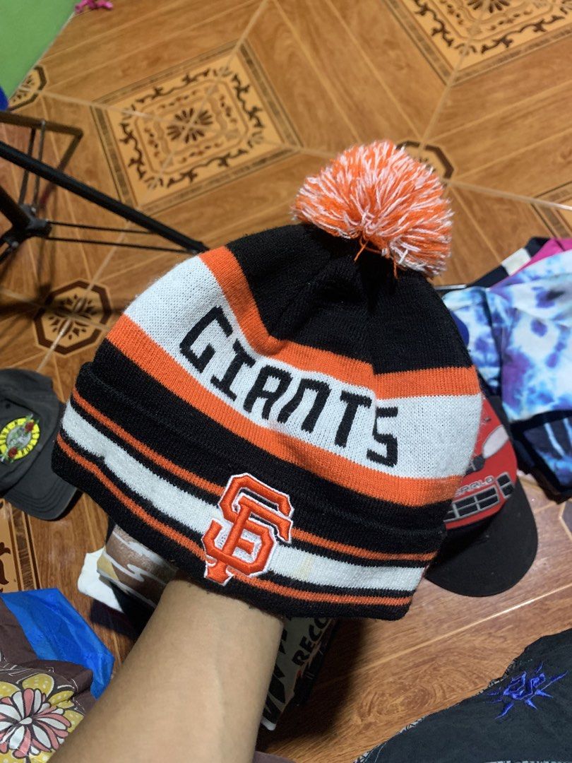 San Francisco Giants Pom Pom Beanie (Category: Caps & Hats) located in Manila. Submitted by vintage_junkyard (Listing ID 1445342235, Image 1). Description: - Black and orange beanie - Features 'GIANTS' text and SF logo - Topped with a fun pom pom - Ideal for San Francisco Giants fans - Keeps you warm while looking stylish.