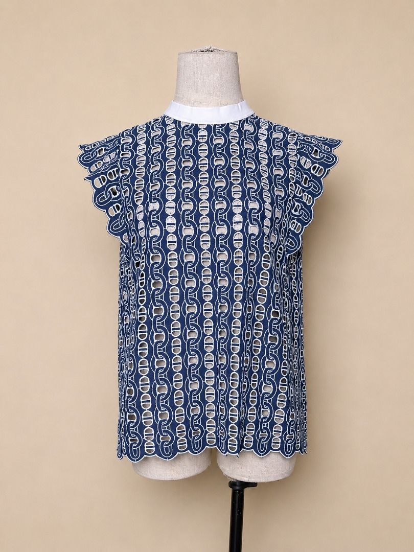 Sandro Inspired Navy White Chain-Link Pattern Guipure Lace Blouse (Category: Blouses) located in Quezon City. Submitted by qratedmnl (Listing ID 1445417691, Image 2). Description: 📌 ITEM DESCRIPTION Sandro inspired top featuring a navy and white chain-link patterned guipure lace with a contrast white rib-knit neckline. Flutter cap sleeves. Button-front back. Size 2 on tag. Approximate measurements when laid flat: Shoulder: 12 inches Bust: 18 inc
