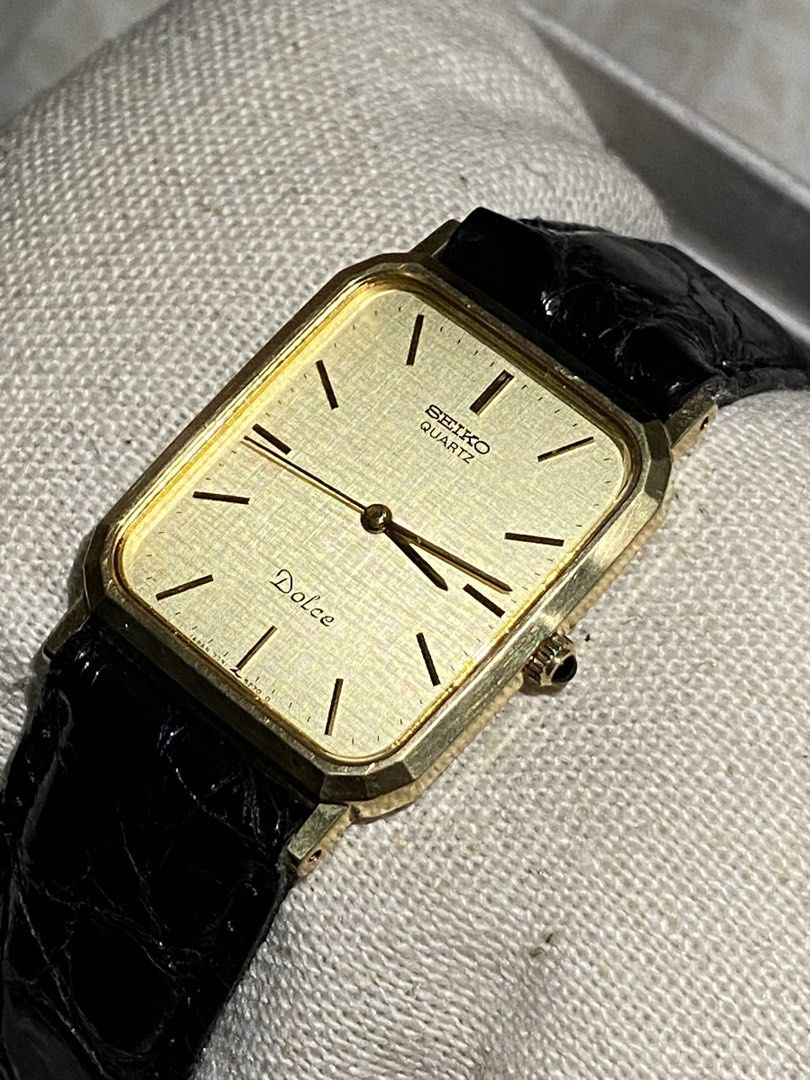 Seiko Dolce Quartz Watch Gold Tone Rectangle (Category: Luxury Watches) located in Quezon City. Submitted by notmiggol (Listing ID 1445281990, Image 1). Description: - Manufacturing date: December 1987 - Ref. No. 7D0533 - Very good running condition - Gold tone Seiko Dolce watch - Rectangle face with textured dial - Black leather strap(Mimosa) with gold buckle - Japanese quartz movement - Antimagnetic - Stainless steel case - Classic timepiece - 