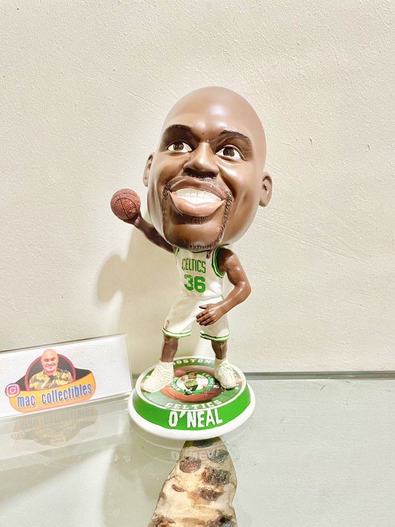 Shaquille O'Neal Celtics Bighead Bobblehead (Category: Figurines & Statues) located in Paranaque City. Submitted by desayer02 (Listing ID 1445390870, Image 1). Description: Shaquille O'Neal bobblehead in his Boston Celtics uniform. Number 36 on the jersey. Stands on a green base with his name. Great collectible for any Celtics fan. Perfect for display on a shelf or desk. It is a rare bighead bobblehead of Shaquille Oneal. This is manufactured by 