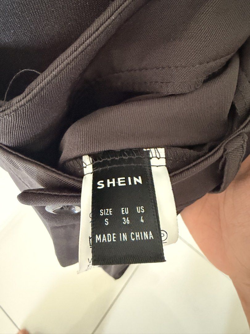 SHEIN Patchwork Flare Pants (Category: Other Bottoms) located in Kuala Lumpur. Submitted by ndhrhmat (Listing ID 1445308626, Image 2). Description: - SHEIN Brown & Black Patchwork Flare Pants - Size: S - Closure: Button and zip - Style: Wide leg, flare - Condition: Brand new, never worn - Perfect for a bold, statement outfit.