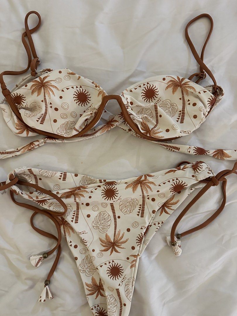 Shein White Palm Tree Print Bikini Set XL (Category: Bikinis & Swimsuits) located in Quezon City. Submitted by talamnl (Listing ID 1445395900, Image 1). Description: - White bikini with a fun brown palm tree and sun print. - Adjustable tie sides on the bikini bottoms for a custom fit. - Supportive underwire top for comfort and shape. - Size XL.