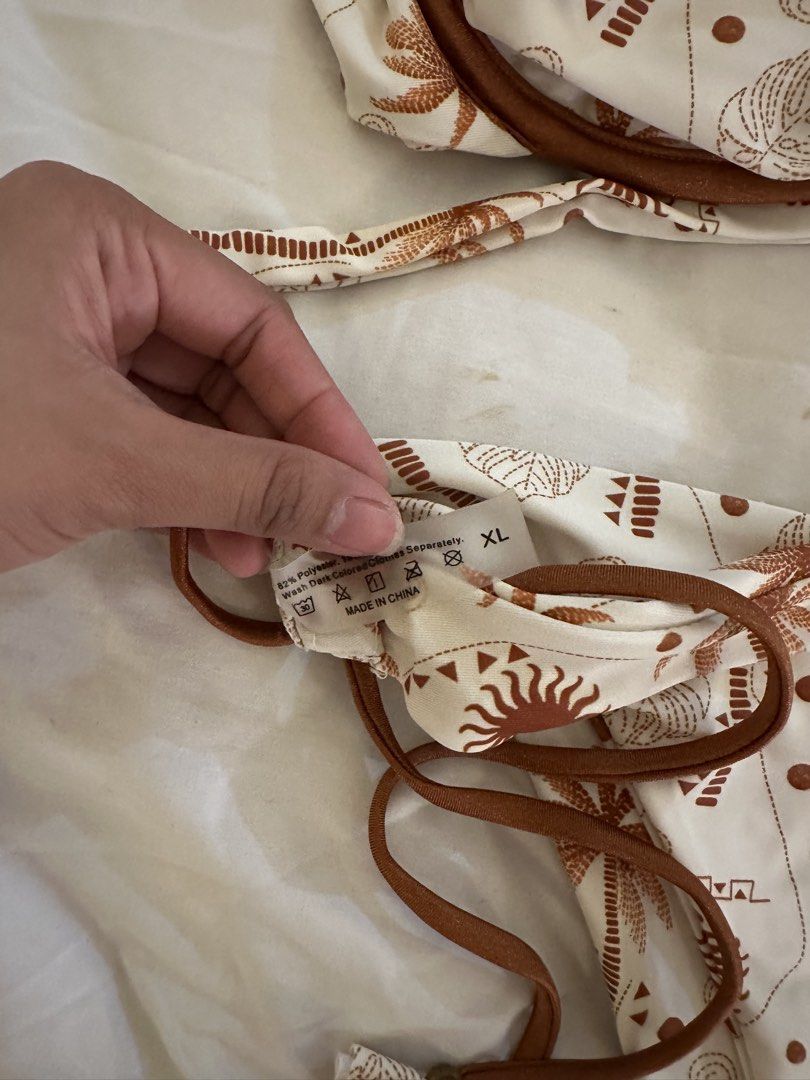 Shein White Palm Tree Print Bikini Set XL (Category: Bikinis & Swimsuits) located in Quezon City. Submitted by talamnl (Listing ID 1445395900, Image 3). Description: - White bikini with a fun brown palm tree and sun print. - Adjustable tie sides on the bikini bottoms for a custom fit. - Supportive underwire top for comfort and shape. - Size XL.