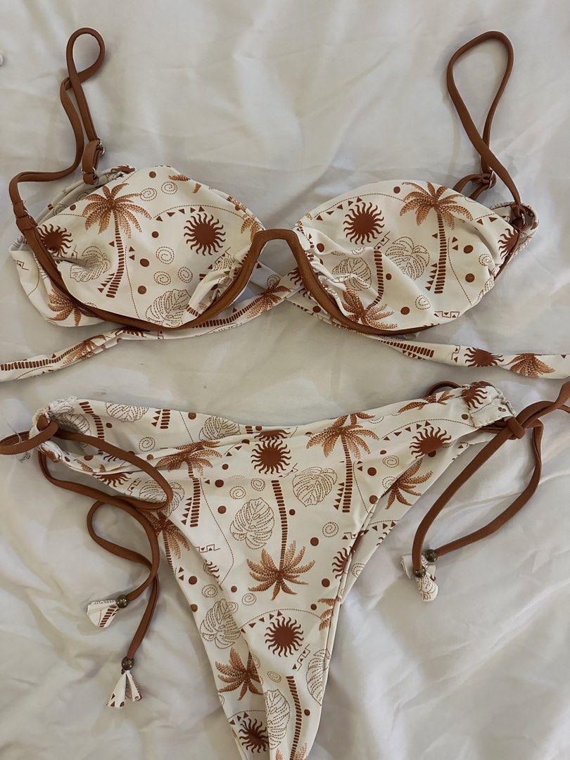 Shein White Palm Tree Print Bikini Set XL (Category: Bikinis & Swimsuits) located in Quezon City. Submitted by talamnl (Listing ID 1445395900, Image 2). Description: - White bikini with a fun brown palm tree and sun print. - Adjustable tie sides on the bikini bottoms for a custom fit. - Supportive underwire top for comfort and shape. - Size XL.