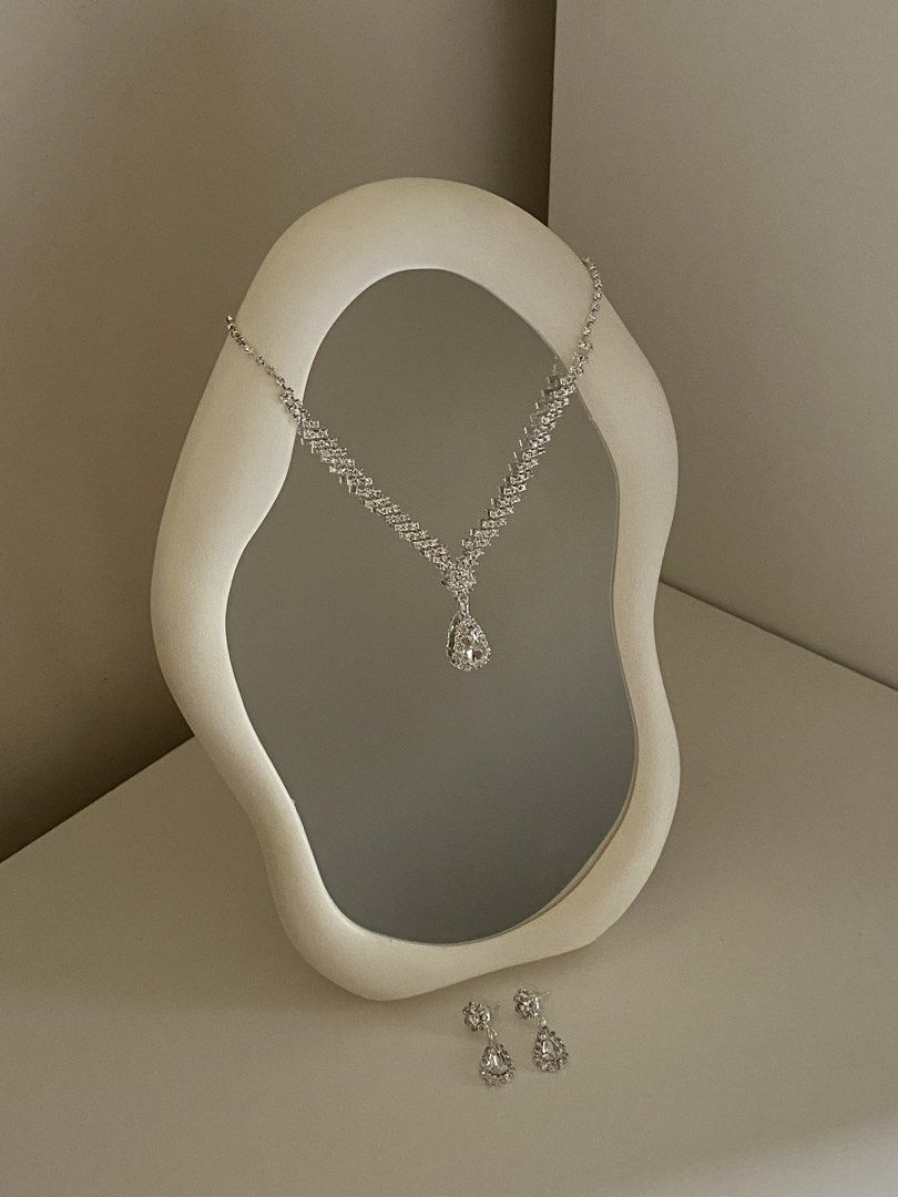 Silver Rhinestone Necklace and Earrings Set (Category: Necklaces) located in Manila. Submitted by kellemirah (Listing ID 1445241874, Image 1). Description: - Beautiful necklace and matching earrings set. - Features a sparkling teardrop pendant on the necklace. - Includes elegant dangle earrings. - Lots of sparkle, perfect for special occasions. - Adds instant glamour and elegance to any outfit. I’m also selling the cloud mirror for 300 pesos only