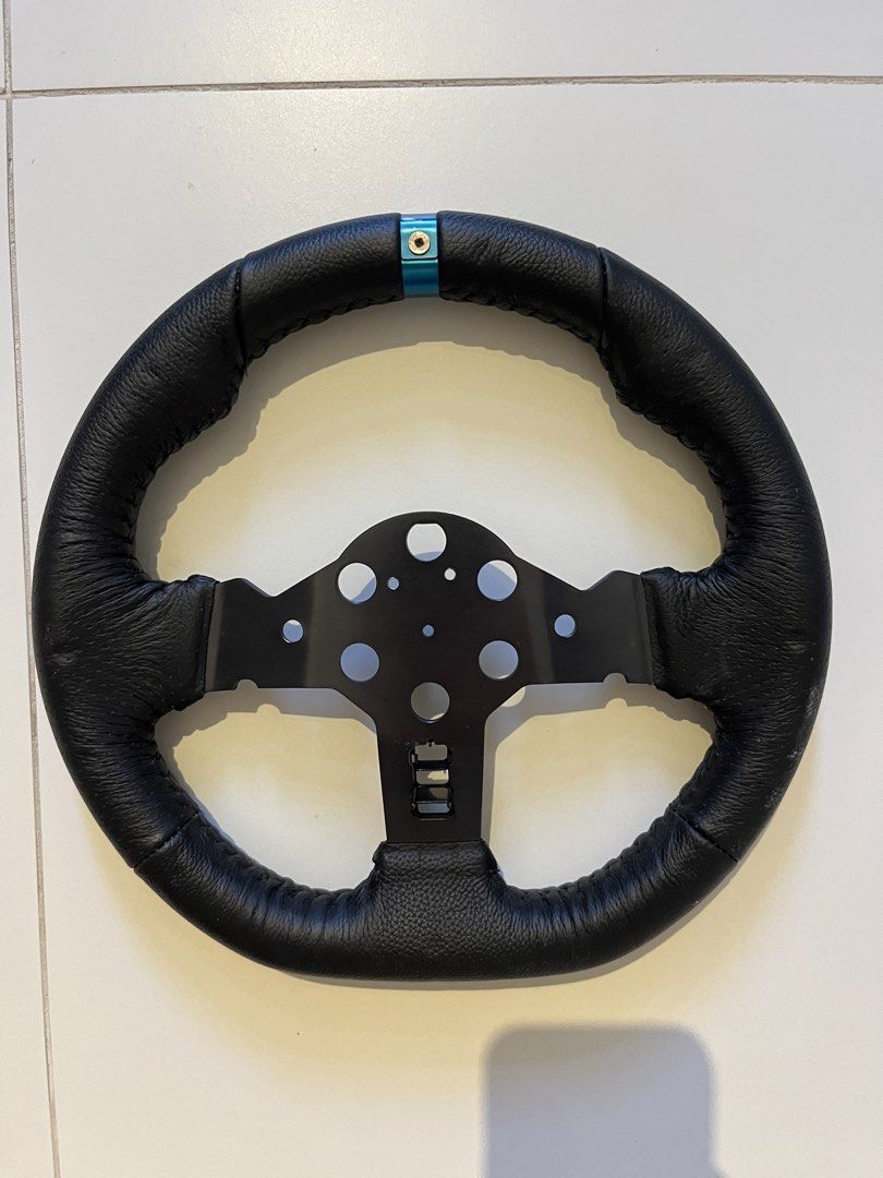 Sim Racing Steering Wheel (Category: Controllers) located in Manila. Submitted by thriftnikeenan (Listing ID 1445304366, Image 2). Description: steering wheel only i dont know much about this item, im just disposing it.