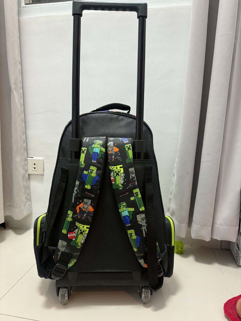Smiggle Minecraft (Category: Backpacks) located in Quezon City. Submitted by thingsdeclutter (Listing ID 1445236267, Image 2). Description: Preloved but well loved Trolley or backpack With lights sa gulong With minor dents but hindi pansinin I can send video for those interested .