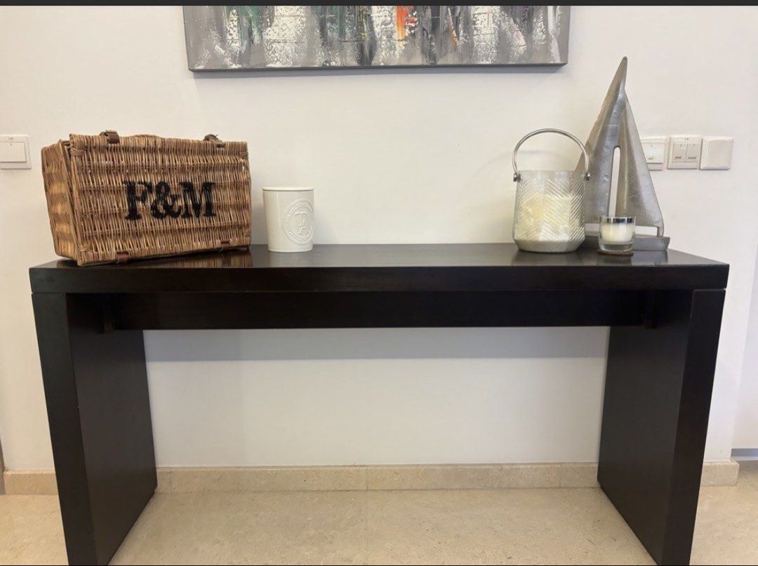 Solid Dark Wood Console Table (Category: Tables & Sets) located in Singapore. Submitted by fionahawle95089 (Listing ID 1445324301, Image 1). Description: - Sleek dark wood console table - Modern design, ideal for entryways or living rooms - Perfect for displaying your favorite items - - 150 by 40 by 78 approx. .