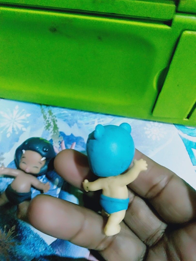 Sonny Angel Figures - Animal Series (Category: Designer & Blind Box Toys) located in Davao. Submitted by bravemoon_556cd5 (Listing ID 1445408489, Image 3). Description: - Two Sonny Angel collectible figures - One features a dark blue dinosaur-like helmet - The other has a light blue bear helmet - Both figures are wearing blue bottoms - Ideal for display or as a gift for collectors.