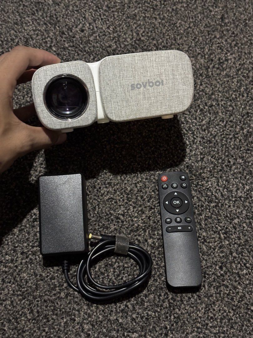 Sovboi Mini Video Projector (Category: Projectors) located in Bulacan. Submitted by thriftstarph (Listing ID 1445285458, Image 1). Description: PLEASE RESD THE DESCRIPTION BELOW‼️ Sovboi 720P Mini Projector Wireless Screen Mirroring With Remote And Chager No box No Issue.