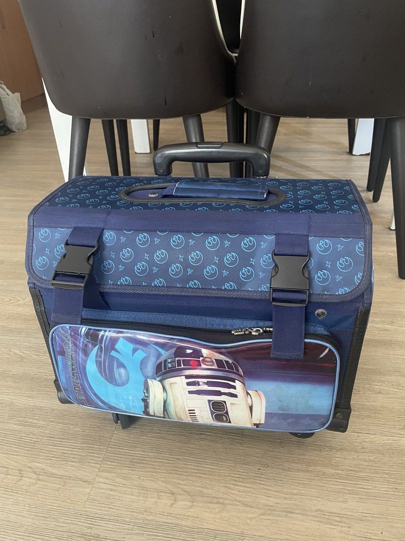 Star Wars R2-D2 Rolling Luggage Suitcase (Category: Luggage) located in Taguig. Submitted by declutteringmom314 (Listing ID 1445290837, Image 3). Description: - Cool Star Wars rolling luggage featuring R2-D2 graphic - Navy blue - Retractable handle and wheels for easy transport - Perfect for kids or any Star Wars fan - bought at P5K++ at SM.