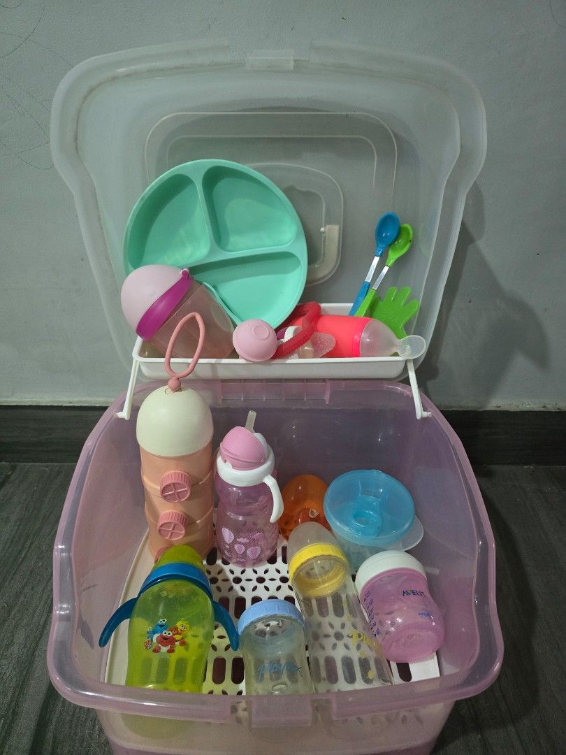 Take all !! Baby Bottle Drying Rack and Storage Container with Accessories (Category: Breastfeeding & Bottle Feeding) located in Makati City. Submitted by zshar (Listing ID 1445302870, Image 2). Description: - Portable baby bottle drying rack and storage box - Includes baby bottles, sippy cups, plate, and utensils - Multiple holders for bottles and accessories - Clear lid for dust-free storage - Perfect for travel or home use - Easy to clean and 