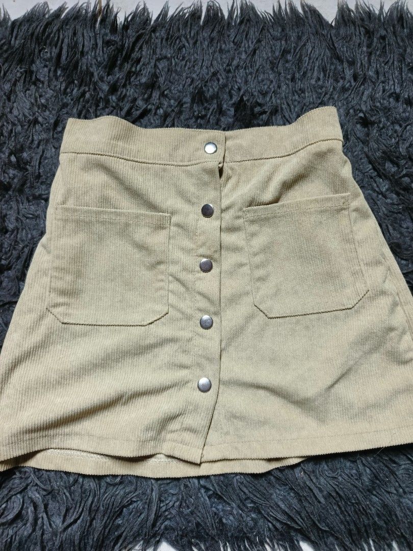 Tan Corduroy Button-Front A-Line Mini Skirt (Category: Skirts) located in Tagaytay City. Submitted by graceann06 (Listing ID 1445405378, Image 1). Description: - Cute tan corduroy skirt - Button front closure - Two functional front pockets - Elastic waistband at the back for a comfortable fit - Ideal for casual everyday wear - Versatile and easy to style.