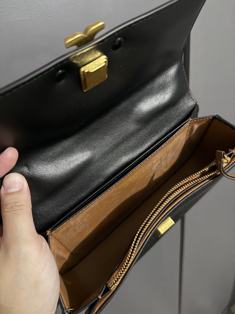 Tory Burch Kira Chevron Small Camera Bag Black Leather (Category: Luxury Bags & Wallets) located in Quezon City. Submitted by akestrella (Listing ID 1445238804, Image 3). Description: - class A Black Tory Burch Kira Chevron Small Camera Bag - Made from Genuine Leather - Elegant Gold Hardware - Iconic Tory Burch Logo on Front - Secure Zip Closure - Adjustable Strap for Comfort - Interior Card Slots - Interior Zippered Pocket - Versatile for Everyd