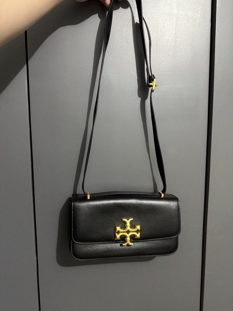Tory Burch Kira Chevron Small Camera Bag Black Leather (Category: Luxury Bags & Wallets) located in Quezon City. Submitted by akestrella (Listing ID 1445238804, Image 2). Description: - class A Black Tory Burch Kira Chevron Small Camera Bag - Made from Genuine Leather - Elegant Gold Hardware - Iconic Tory Burch Logo on Front - Secure Zip Closure - Adjustable Strap for Comfort - Interior Card Slots - Interior Zippered Pocket - Versatile for Everyd
