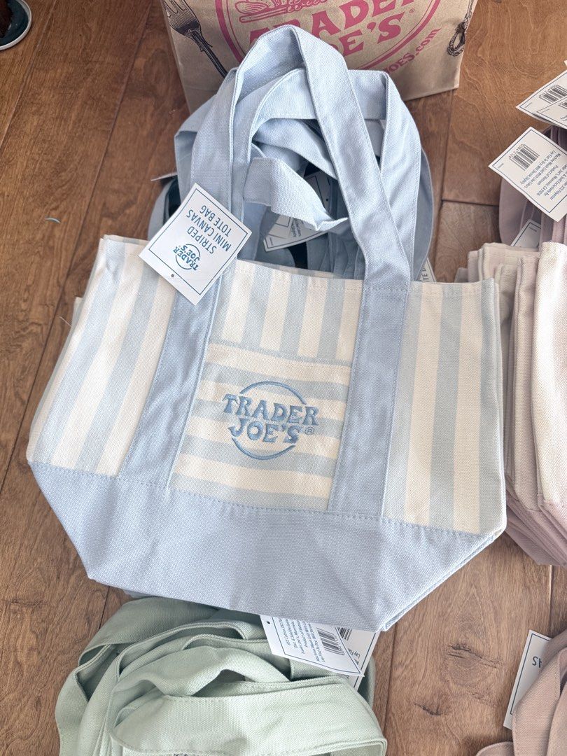Trader Joe's Striped Mini Canvas Tote Bag (Category: Tote Bags) located in Quezon City. Submitted by joyandjoy (Listing ID 1445240730, Image 3). Description: - Cute mini tote bags from Trader Joe's - Available in pastel blue, pink, and mint green - Features vertical stripes - Includes a small front pocket - Perfect for groceries or everyday essentials.