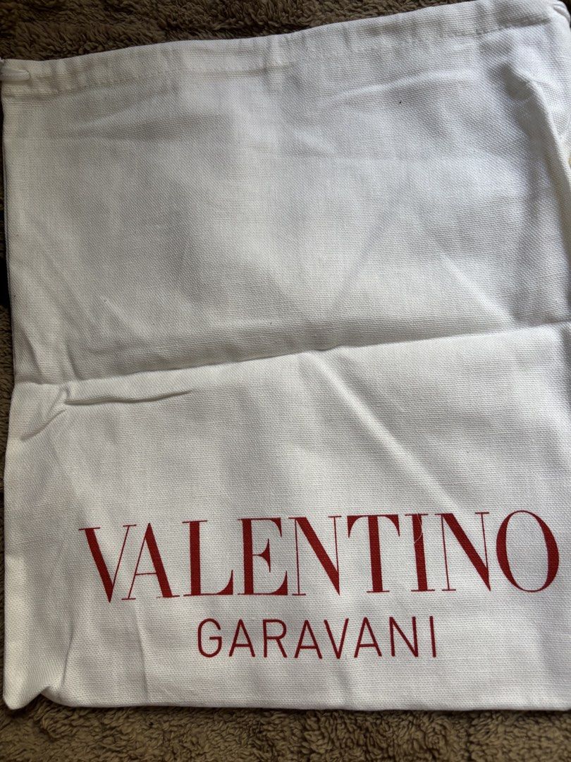 Valentino Garavani Dust Bag (Category: Luxury Bags & Wallets) located in Manila. Submitted by livfindsph (Listing ID 1445264196, Image 1). Description: - Authentic Valentino Garavani dust bag - White canvas material - Features iconic red logo - Secure drawstring closure - Ideal for protecting designer bags and shoes - Keeps items safe and dust-free.