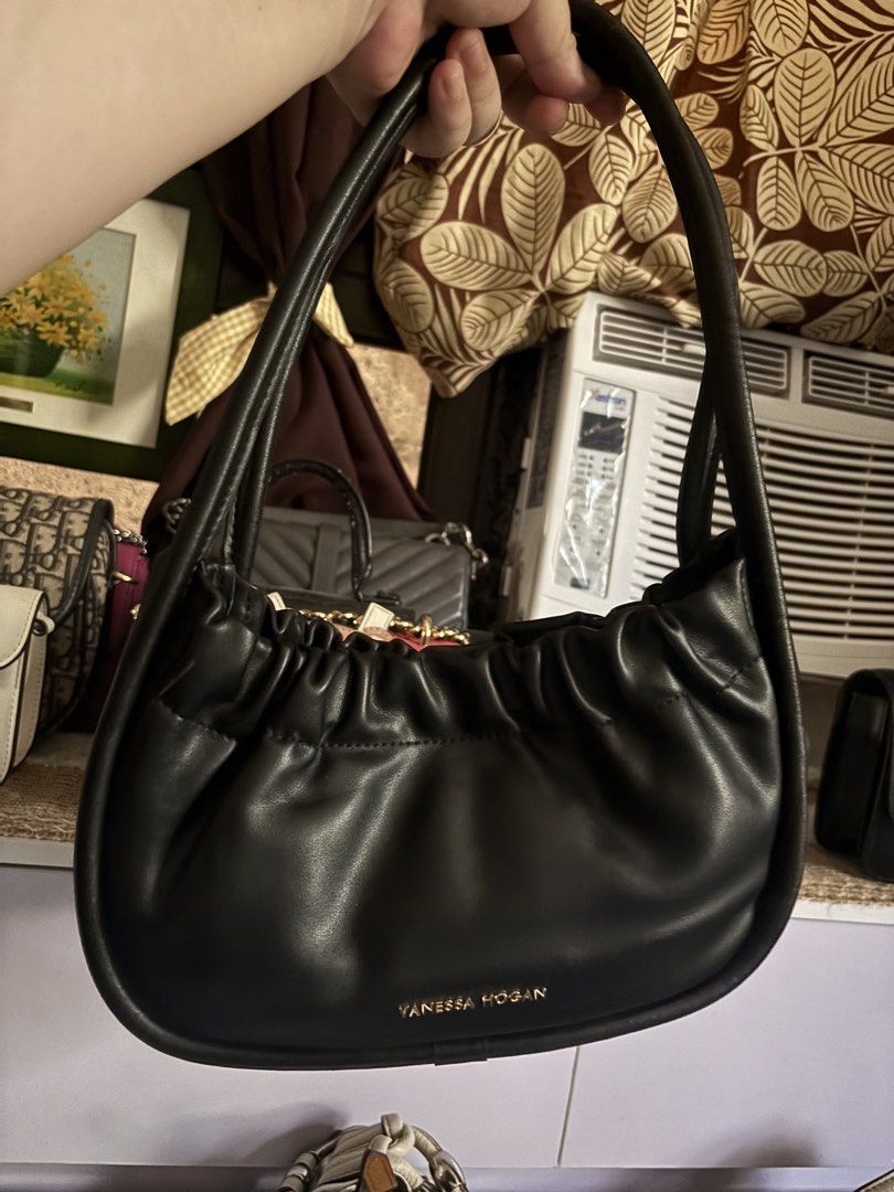 Vanessa Hogan Black Ruched Leather Shoulder Bag (Category: Shoulder Bags) located in Balanga. Submitted by bearsellerr (Listing ID 1445309765, Image 1). Description: - Black Vanessa Hogan shoulder bag - Made of soft, ruched leather - Elegant gold tone hardware details - Secure magnetic snap closure - Lined interior with a zipped pocket - Smooth leather handle - Beautiful, classic shape - Ideal for everyday use.