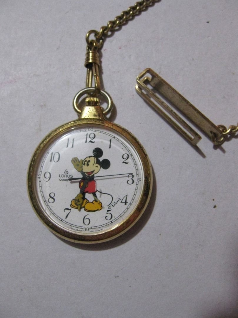 Vintage Lorus Mickey Mouse Pocket Watch & Chain (Category: Vintage Collectibles) located in Baguio. Submitted by mrbrunno (Listing ID 1445249104, Image 1). Description: Vintage Lorus Mickey Mouse Pocket Watch & Chain In Very good condition as seen in pics. 1990 Working, just needs new battery. Part of my Disney/Mickey watch collection. 1 .