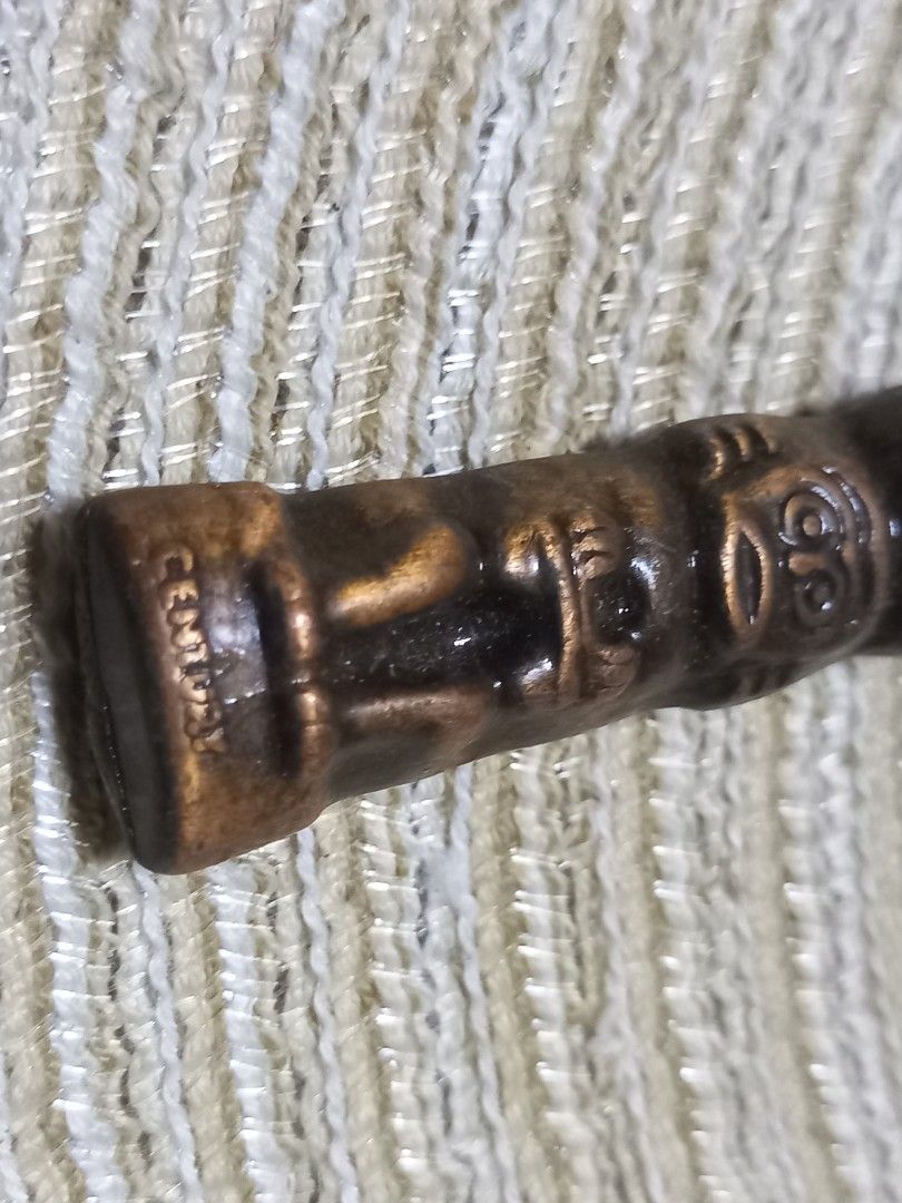 Vintage Totem Pole Bottle Opener (Category: Vintage Collectibles) located in Manila. Submitted by riaring88 (Listing ID 1445305667, Image 3). Description: - vintage totem pole design bottle opener - Features a Canadian maple leaf emblem - Made of metal with a bronze-like finish - Unique piece for your bar or collection - Marked 'Made in Canada' on the end.