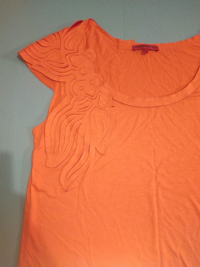 VIVIENNE TAM - Y2K SLEEVELESS TEE (Category: Blouses) located in Cebu City. Submitted by whainstone (Listing ID 1445294896, Image 3). Description: Excellent condition Tagged size - M Width - 18" Length - 24" Photos may vary due to lighting Php 650 + 90 (sf) Mop: gcash/bank Thank you & Godbless. 🤗.