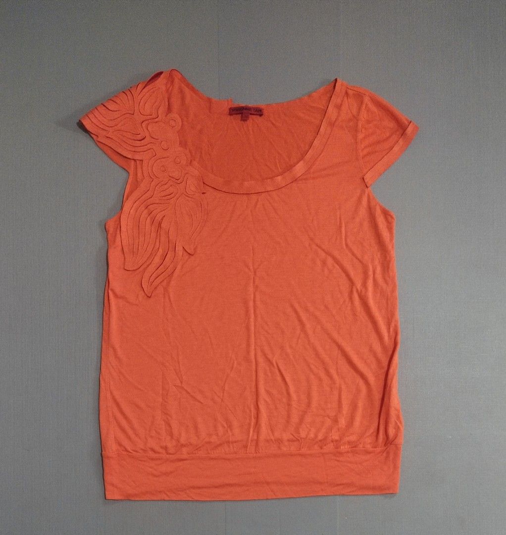 VIVIENNE TAM - Y2K SLEEVELESS TEE (Category: Blouses) located in Cebu City. Submitted by whainstone (Listing ID 1445294896, Image 1). Description: Excellent condition Tagged size - M Width - 18" Length - 24" Photos may vary due to lighting Php 650 + 90 (sf) Mop: gcash/bank Thank you & Godbless. 🤗.