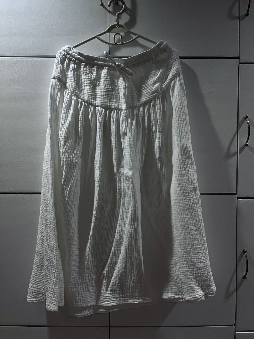 White Gauze Midi Skirt with Drawstring Waist (Category: Skirts) located in Quezon City. Submitted by fretdavid (Listing ID 1445355242, Image 1). Description: - White gauze midi skirt - Elastic waistband with drawstring tie - Textured, relaxed, and flowy fabric - Versatile for casual wear and layering - Comfortable and breathable material.