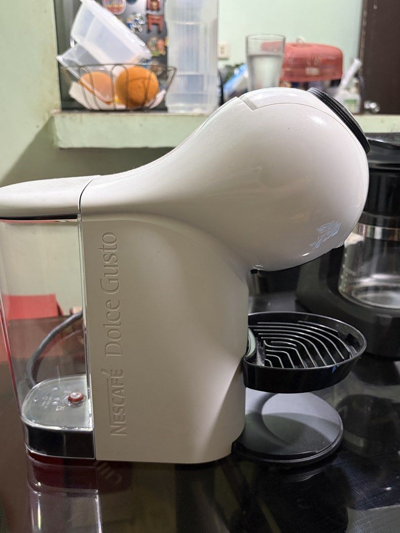 White Nescafé Dolce Gusto Genio S Coffee Machine (Category: Coffee Machines & Makers) located in Manila. Submitted by boldturtle_59402b (Listing ID 1445350497, Image 1). Description: - White Nescafé Dolce Gusto Genio S coffee machine - Features side water tank and drip tray - Top controls for temperature and cup size adjustment - Ready for a new home.
