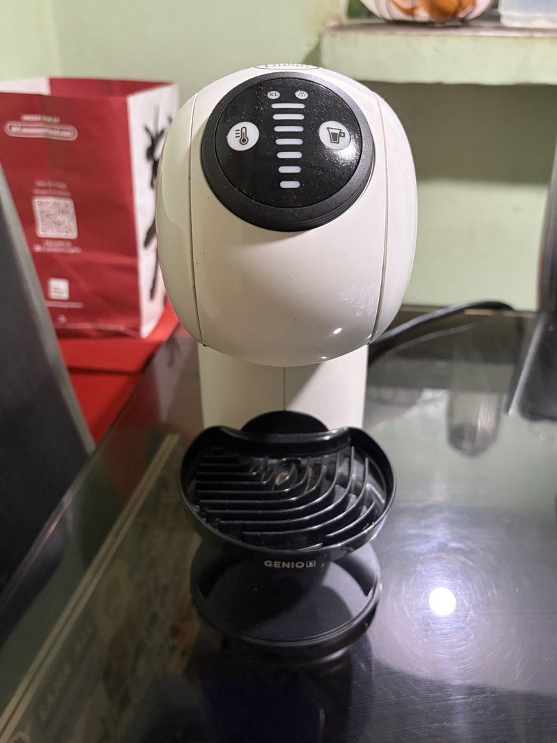 White Nescafé Dolce Gusto Genio S Coffee Machine (Category: Coffee Machines & Makers) located in Manila. Submitted by boldturtle_59402b (Listing ID 1445350497, Image 2). Description: - White Nescafé Dolce Gusto Genio S coffee machine - Features side water tank and drip tray - Top controls for temperature and cup size adjustment - Ready for a new home.
