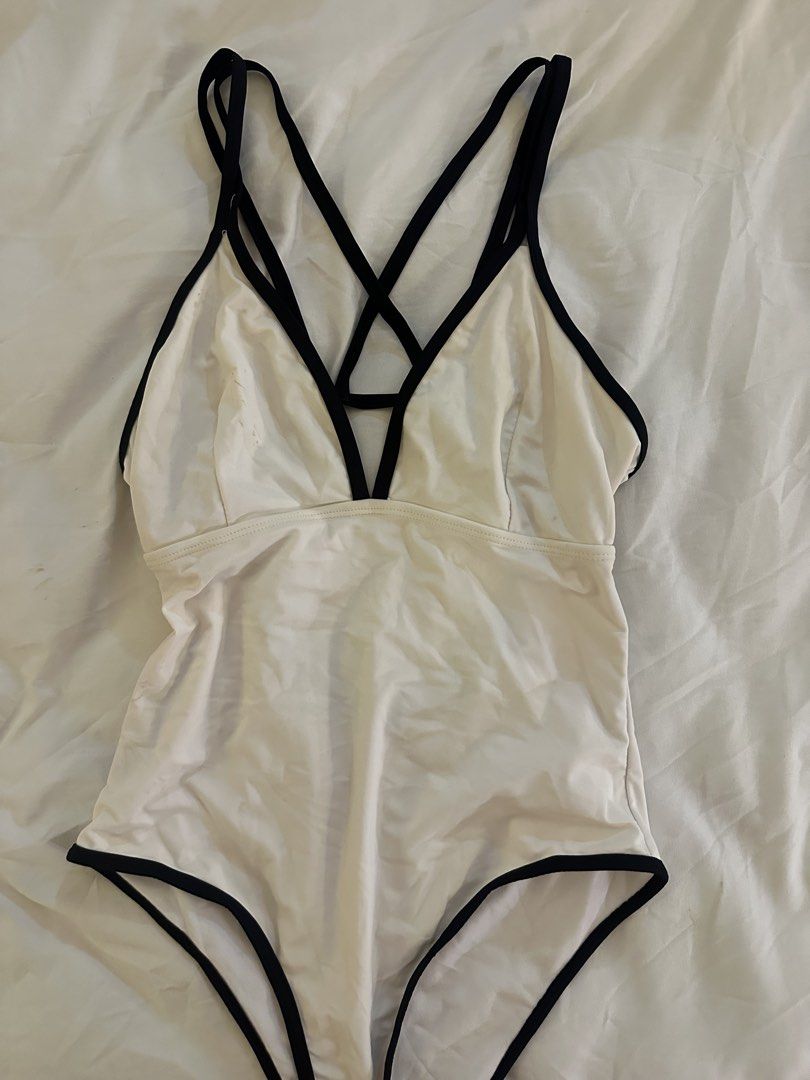 White One-Piece Swimsuit with Black Trim (Category: Bikinis & Swimsuits) located in Quezon City. Submitted by talamnl (Listing ID 1445397236, Image 2). Description: - Classic white one-piece swimsuit - criss-cross strap design at the back - black trim outlines the straps and edges Not padded Pls manage your expectations .