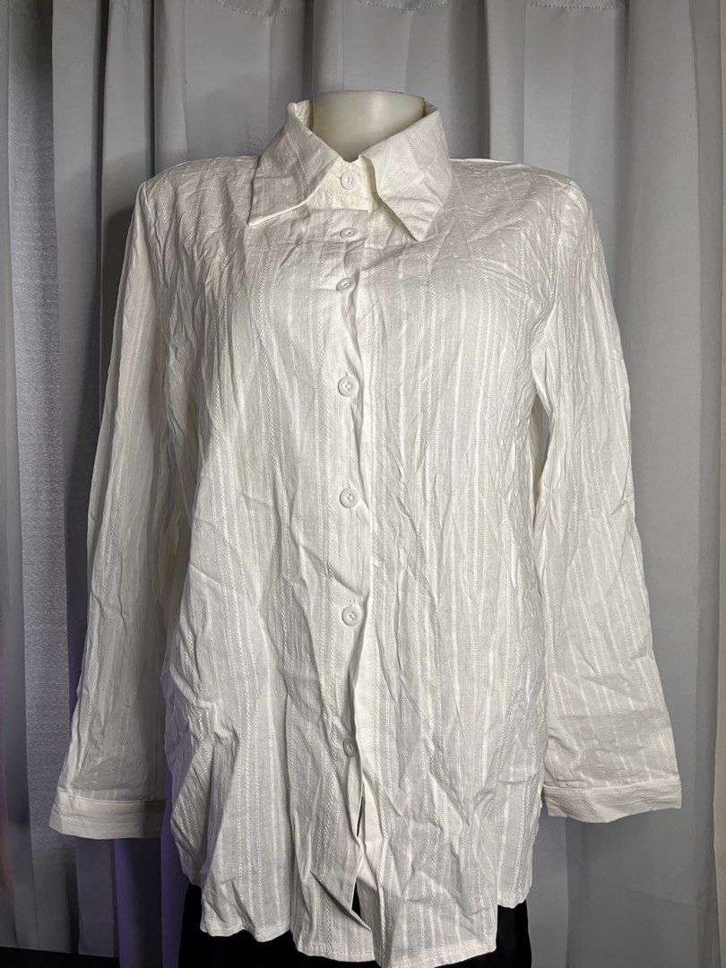 White Textured Long Sleeve Button Up Shirt (Category: Tshirts & Polo Shirts ) located in Baguio. Submitted by gabriyelo (Listing ID 1445374990, Image 1). Description: - Classic white button-up shirt - Subtle textured stripe pattern - Long sleeves with button cuffs - Versatile for any occasion - Great for layering or wearing solo.