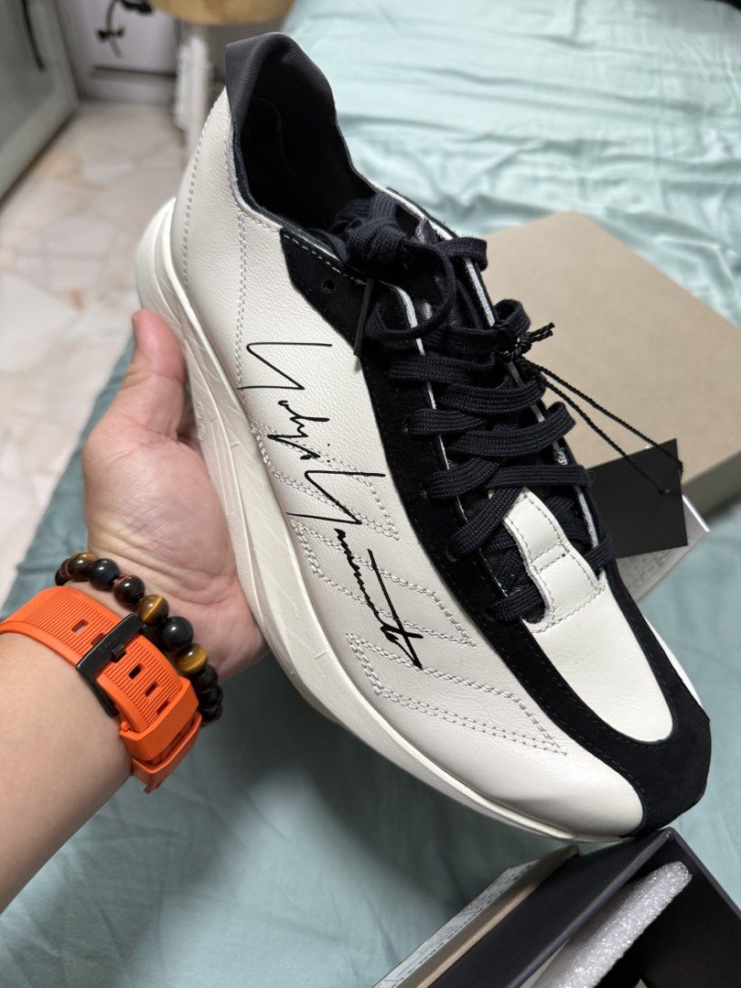 Y-3 Yohji Yamamoto Sneakers (Category: Sneakers) located in Singapore. Submitted by darrenksa2709 (Listing ID 1445264016, Image 2). Description: - Y-3 Yohji Yamamoto Sneakers - Color: White & Black - Signature Yohji Yamamoto autograph detail - Comes with original box - y-3 adios Pro 3 LX.