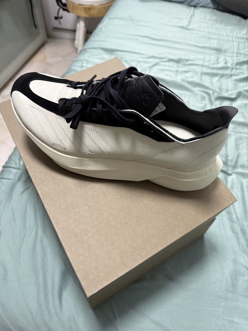 Y-3 Yohji Yamamoto Sneakers (Category: Sneakers) located in Singapore. Submitted by darrenksa2709 (Listing ID 1445264016, Image 1). Description: - Y-3 Yohji Yamamoto Sneakers - Color: White & Black - Signature Yohji Yamamoto autograph detail - Comes with original box - y-3 adios Pro 3 LX.