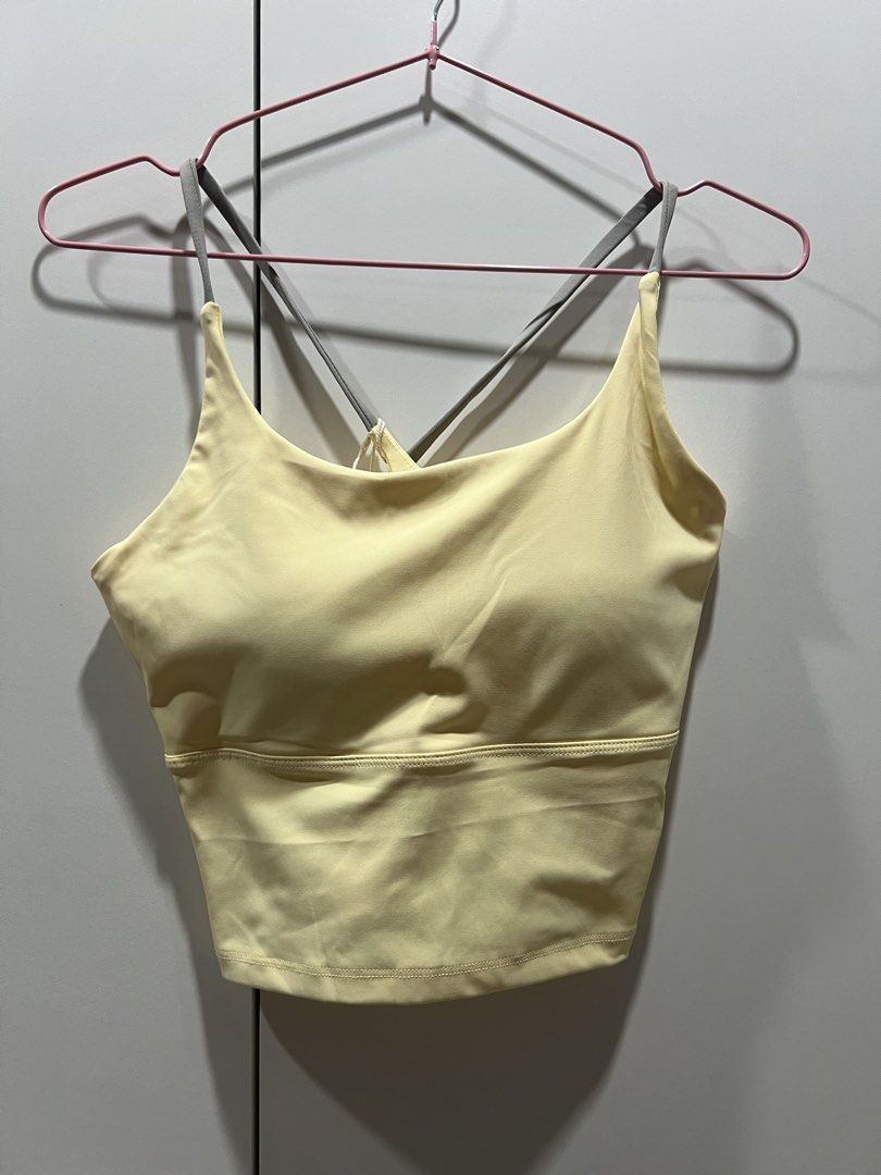 Yellow Sports Bra Crop Top (Category: Activewear) located in Taguig. Submitted by strutstella (Listing ID 1445390913, Image 2). Description: - Vibrant butter yellow sports bra crop top - Stylish strappy back design - Features built-in padding for added comfort and support - Versatile for workouts or casual wear - Easily pairs with various outfits Bought on orange app Brand new with tags Will fit up to 34 b 27 waist .