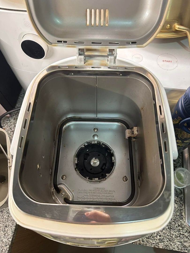 Zojirushi BB-HAQ10 Bread Maker (Category: Other Kitchen Appliances) located in Caloocan City. Submitted by gnv_09dce0 (Listing ID 1445270892, Image 2). Description: - Used Zojirushi Bread Maker (Model BB-HAQ10) - Versatile settings: Basic Bread, French Bread, Quick Baking, Cookie Dough, Cake, Jam - Convenient features: Crust Control, Timer - Includes original bread pan and kneading blade - Interior shows some signs of use, but is generally clean.
