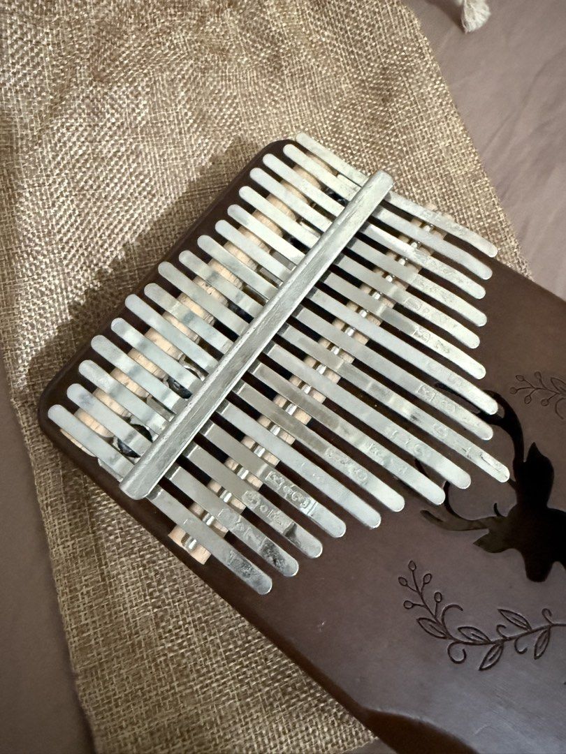 17-Key Kalimba Thumb Piano with Pouch (Category: Musical Instruments) located in Manila. Submitted by ririjeon (Listing ID 1445490220, Image 2). Description: - Beautiful wooden 17-key Kalimba - Features charming deer engraving and floral accents - Comes with a convenient drawstring pouch for storage and travel - Ideal for beginners and aspiring musicians - Easy to learn and produces a lovely, soothing sound.
