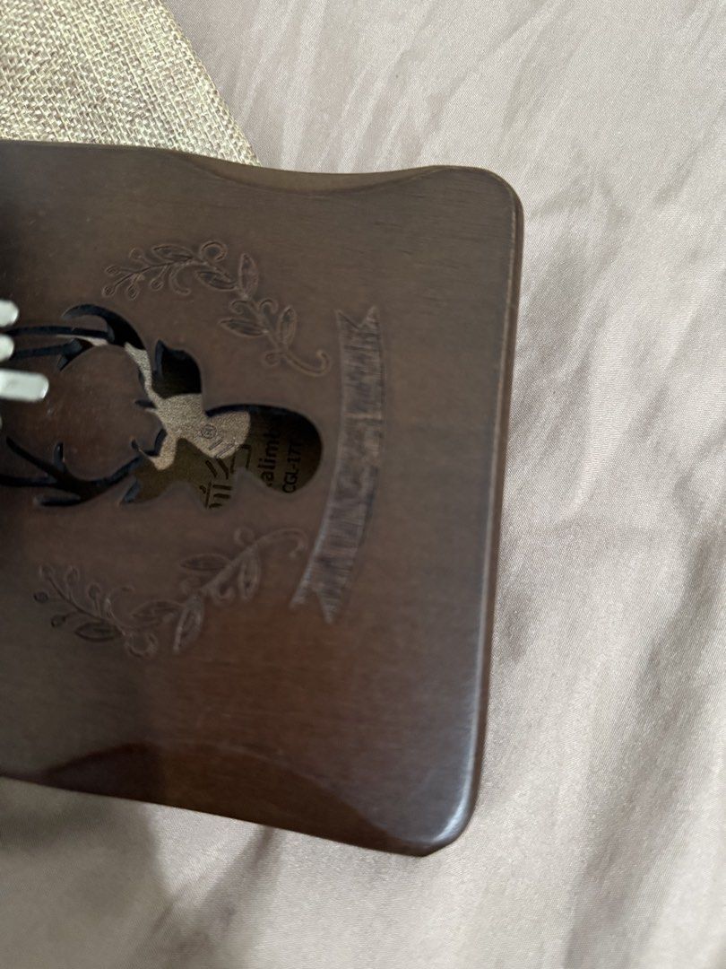 17-Key Kalimba Thumb Piano with Pouch (Category: Musical Instruments) located in Manila. Submitted by ririjeon (Listing ID 1445490220, Image 3). Description: - Beautiful wooden 17-key Kalimba - Features charming deer engraving and floral accents - Comes with a convenient drawstring pouch for storage and travel - Ideal for beginners and aspiring musicians - Easy to learn and produces a lovely, soothing sound.