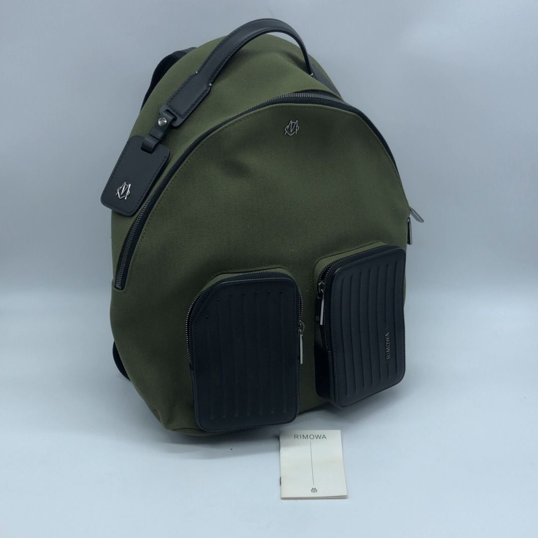 267005835 RIMOWA BAG NEVER STILL BACKPACK (Category: Luxury Bags & Wallets) located in Taguig. Submitted by ecoring.ph (Listing ID 1445460414, Image 1). Description: ◆CONDITION: B ◆DESCRIPTIONS: (Other defects/info:) OUTER: The body of the bag has minimal stains and shows signs of use. The leather on the trunk pocket, tabs, top handle, and backpack strap of the bag is slightly scratched, scuffed, and has press marks and wrinkles, and shows signs 