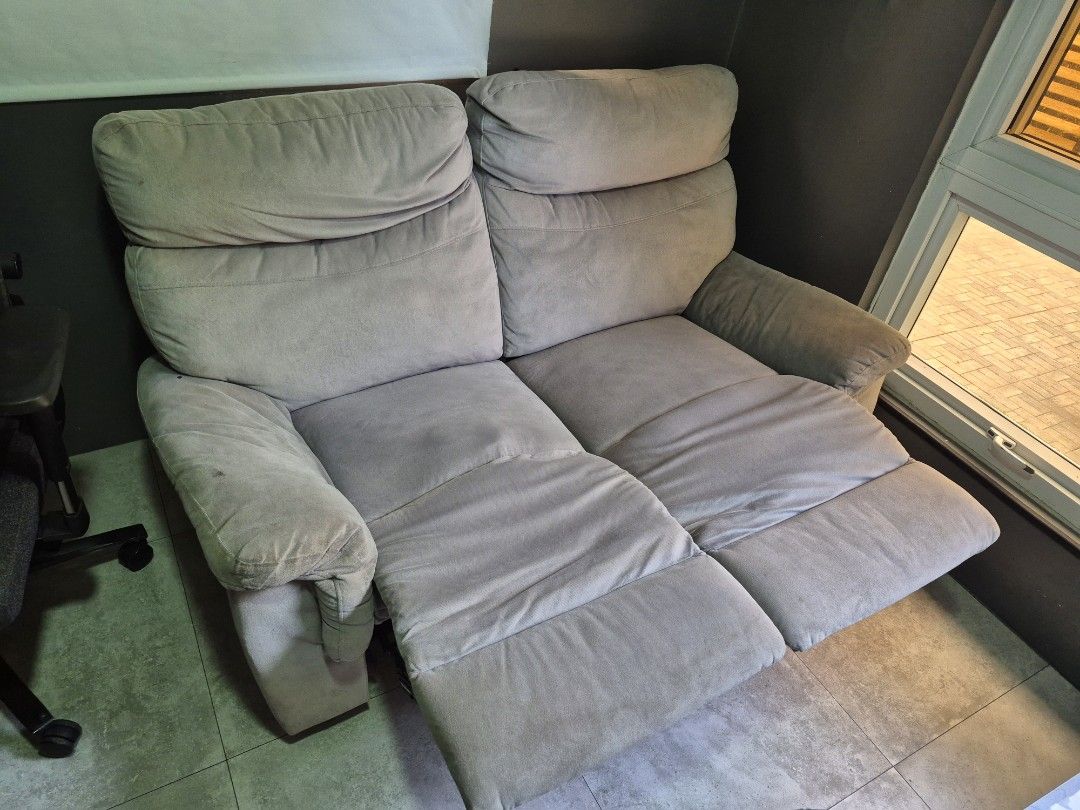2-Seater Recliner Sofa (Category: Sofas) located in Muntinlupa City. Submitted by carlos.angelique (Listing ID 1445420863, Image 3). Description: - Comfortable 2-seater sofa - Both sides recline for extra relaxation - Soft fabric upholstery - Ideal for movie nights or lounging - Fits well in most living spaces - Bought from Mandaue Foam - Slightly damaged on the right side (spring needs fixing) see pic.
