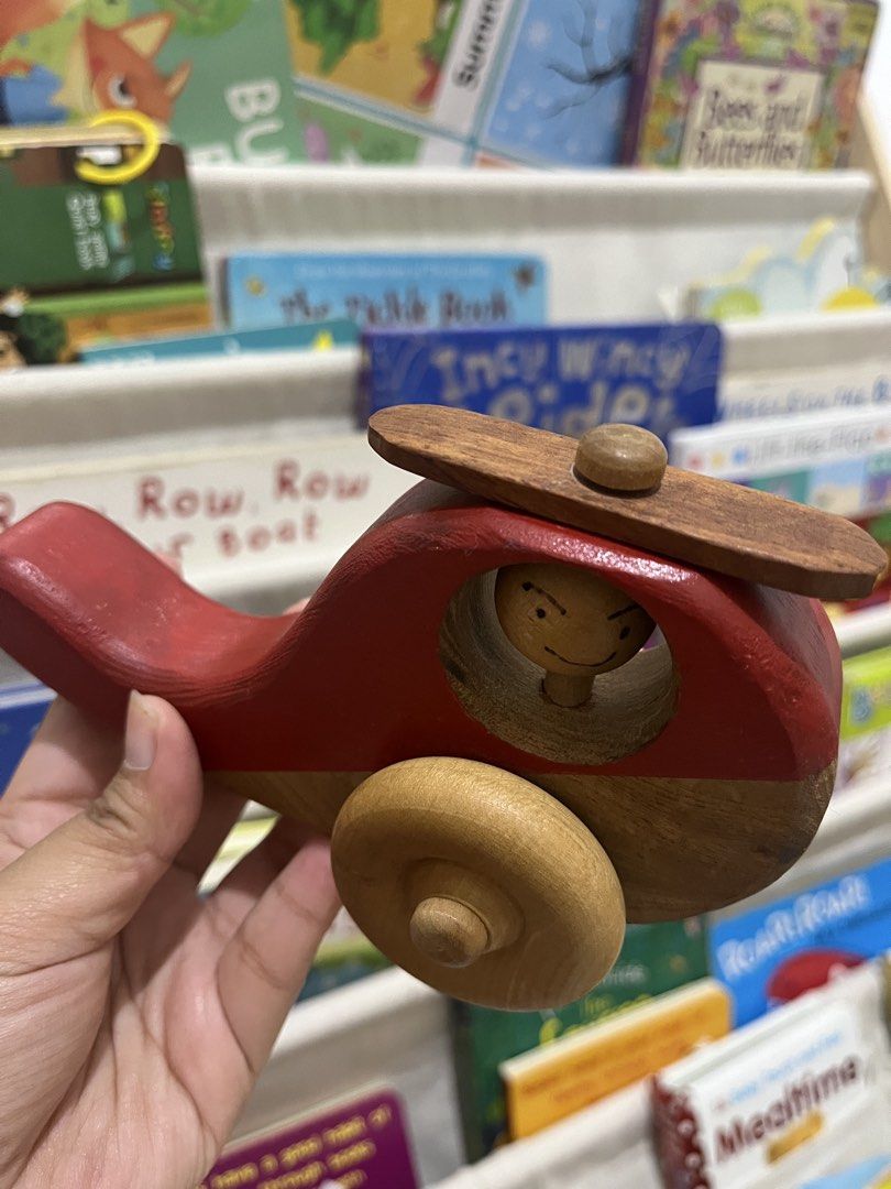 🚁 Wooden Helicopter Toy (Category: Kids Toys) located in Makati City. Submitted by darandandandan (Listing ID 1445527505, Image 2). Description: • Beautiful wooden helicopter with spinning rotor • Encourages imaginative play and fine motor skill development • Smooth-rolling wooden wheels for push-and-go fun • Sturdy wooden construction with a charming handcrafted look • Features a cute pilot character inside the cockpit • Preloved and well-maint