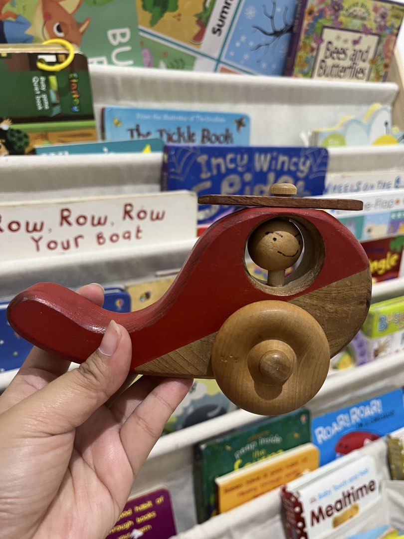 🚁 Wooden Helicopter Toy (Category: Kids Toys) located in Makati City. Submitted by darandandandan (Listing ID 1445527505, Image 1). Description: • Beautiful wooden helicopter with spinning rotor • Encourages imaginative play and fine motor skill development • Smooth-rolling wooden wheels for push-and-go fun • Sturdy wooden construction with a charming handcrafted look • Features a cute pilot character inside the cockpit • Preloved and well-maint