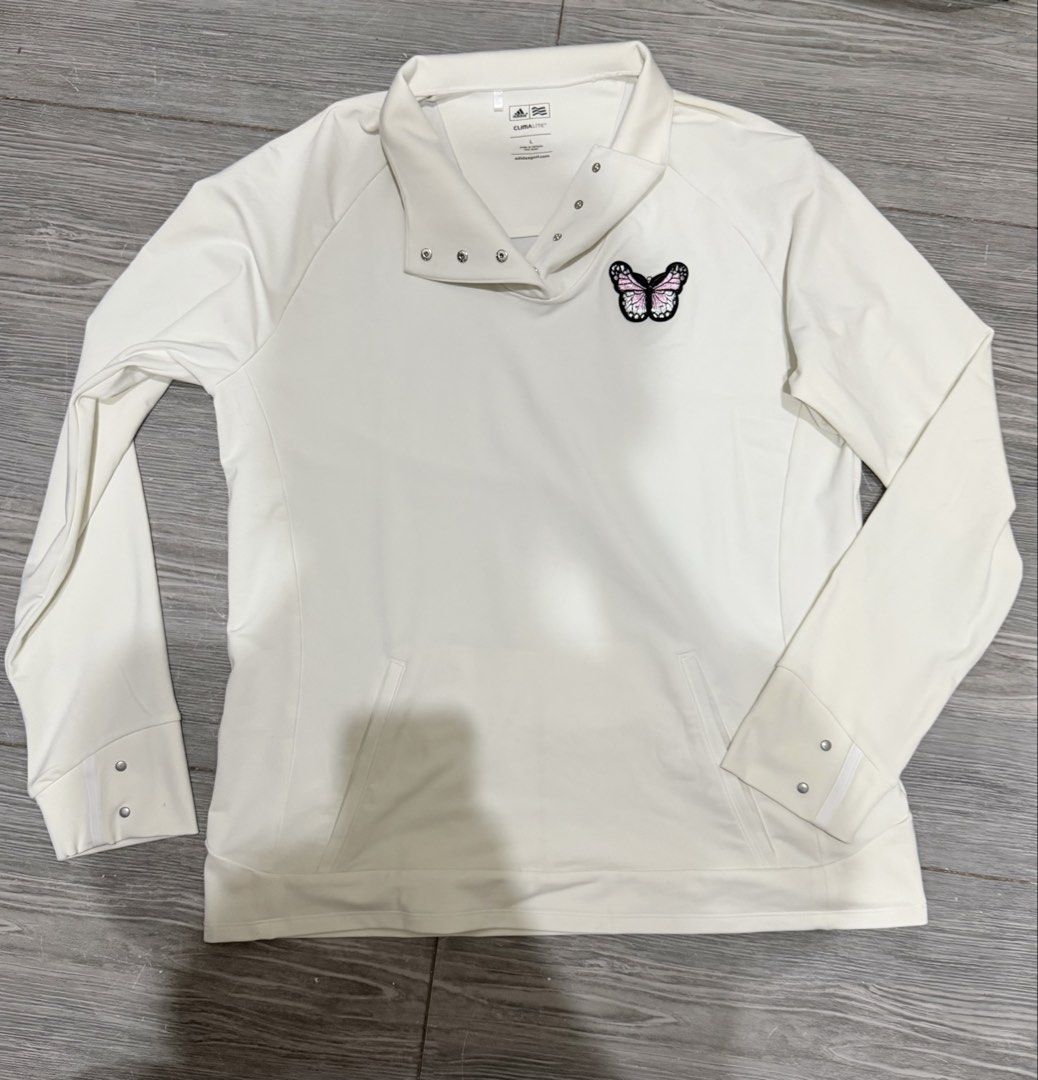 Authentic Adidas CLIMALITE Long Sleeve Pullover with Butterfly Detail (Category: Activewear) located in Iligan City. Submitted by jytomps (Listing ID 1445558424, Image 2). Description: - Dirty White Adidas long sleeve pullover - Size: L - Snap-button collar - Cute pink and black butterfly patch on chest - CLIMALITE material for comfort - Ideal for golf or casual wear -From the US -RFS need funds .