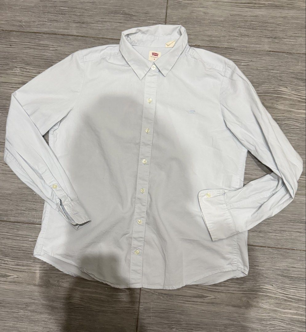 Authentic Levi's Classic Fit Button-Up Shirt - Light Blue (Category: Longsleeves) located in Iligan City. Submitted by jytomps (Listing ID 1445558420, Image 1). Description: - Brand: Levi's - Style: Classic fit button-up shirt - Color: Light blue - Features: Small embroidered Levi's logo on chest - Size: Tagged Medium (M) but can fit to small - Occasion: Ideal for casual or smart-casual outfits -From the US -RFS need funds .