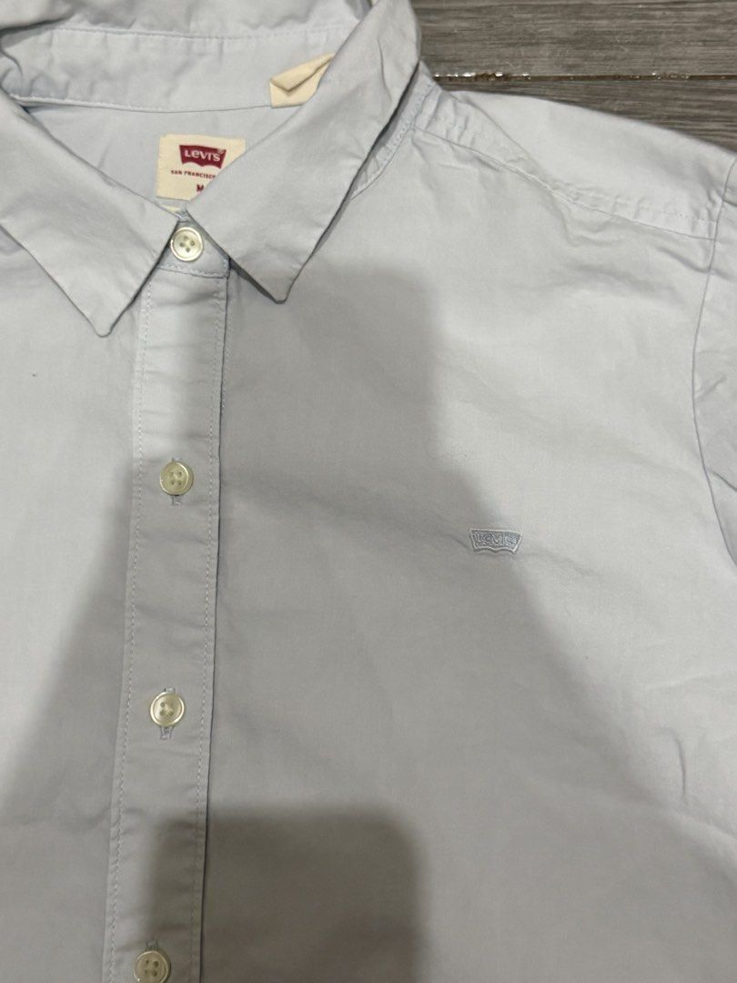 Authentic Levi's Classic Fit Button-Up Shirt - Light Blue (Category: Longsleeves) located in Iligan City. Submitted by jytomps (Listing ID 1445558420, Image 3). Description: - Brand: Levi's - Style: Classic fit button-up shirt - Color: Light blue - Features: Small embroidered Levi's logo on chest - Size: Tagged Medium (M) but can fit to small - Occasion: Ideal for casual or smart-casual outfits -From the US -RFS need funds .