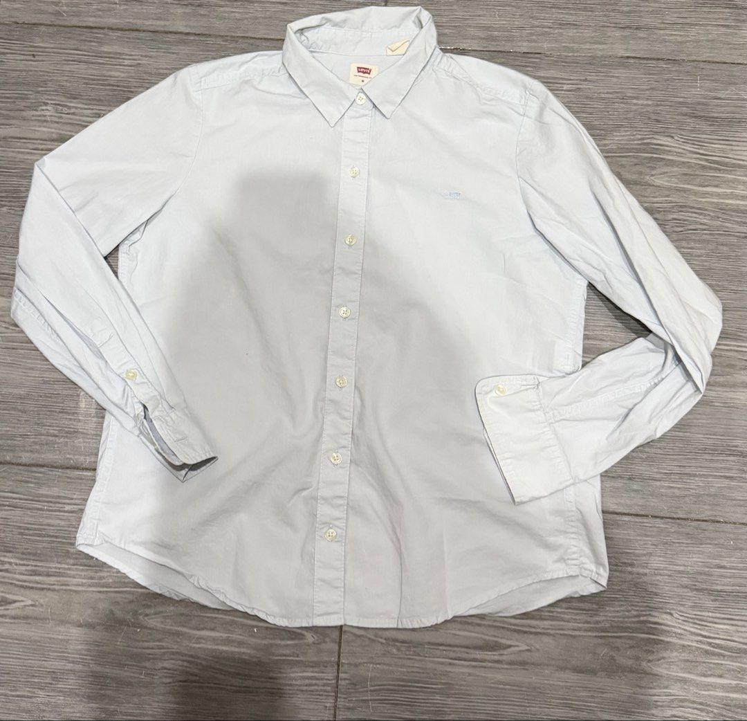 Authentic Levi's Classic Fit Button-Up Shirt - Light Blue (Category: Longsleeves) located in Iligan City. Submitted by jytomps (Listing ID 1445558420, Image 2). Description: - Brand: Levi's - Style: Classic fit button-up shirt - Color: Light blue - Features: Small embroidered Levi's logo on chest - Size: Tagged Medium (M) but can fit to small - Occasion: Ideal for casual or smart-casual outfits -From the US -RFS need funds .