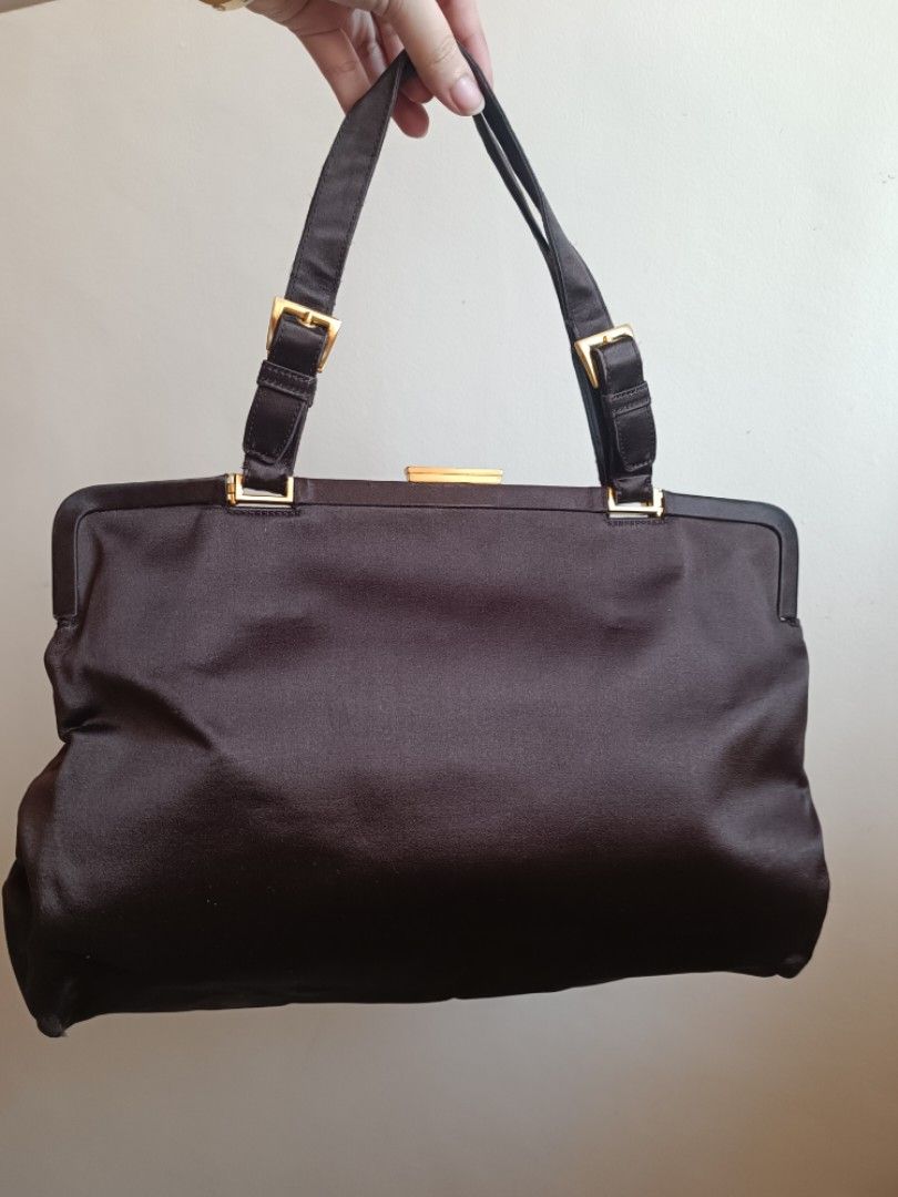 RUSH SALE Prada Raso/Satin bag (Category: Luxury Bags & Wallets) located in Paranaque City. Submitted by earlylux (Listing ID 1445467413, Image 2). Description: FIRST PHOTO FOR REFERENCE ONLY Bigger size than the reference photo Poizon authenticated. Kisslock slightly loose but still nasasara. Rubs on corners. Please inspect photos for signs of usage/flaw. Authentication cards only no other inclusion. Normal signs of usage please manage your expe