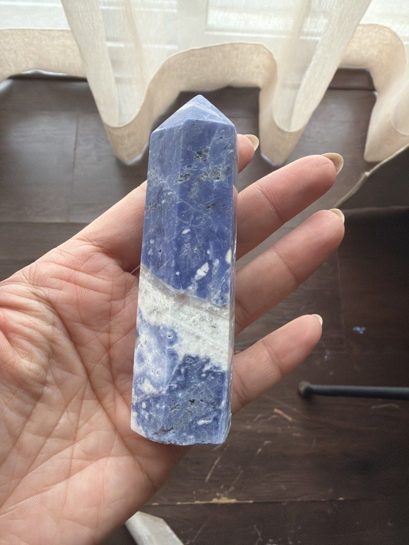 Blue and White Sodalite Crystal tower (Category: Beverages) located in Manila. Submitted by _tala_17 (Listing ID 1445490948, Image 2). Description: - Stunning blue and white crystal point - Ideal for home decor or energy practices - Size comparable to a hand for reference - Each side features unique patterns - Smooth, polished finish.