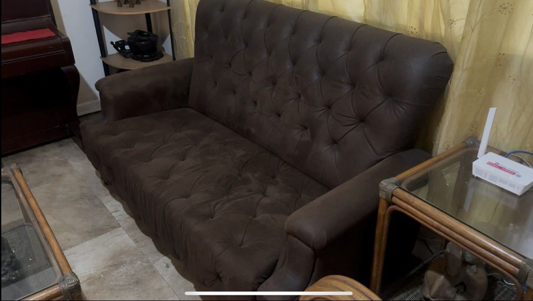 Brown Tufted Chesterfield Loveseat Sofa (Category: Sofas) located in Manila. Submitted by suartina2093025 (Listing ID 1445492727, Image 2). Description: - Classic brown loveseat sofa - Chesterfield style with tufted detailing - Upholstered in soft fabric - Comfortably seats two people - Perfect for living room or study - Minor signs of wear on seat cushion.