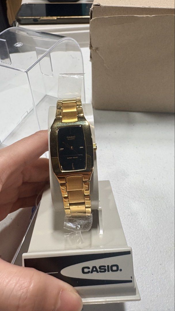 Casio (Category: Women's Watches) located in Angeles City. Submitted by sum49 (Listing ID 1445552510, Image 3). Description: Material: Gold-plated stainless steel for both the case and the triple-fold clasp band. Movement: Japanese Quartz movement. Glass: Mineral Glass, providing basic scratch resistance. Water Resistance: Typically "Water Resistant" for daily splashes or rated up to 50 meters (5 bar) depending on the exact sub-model..