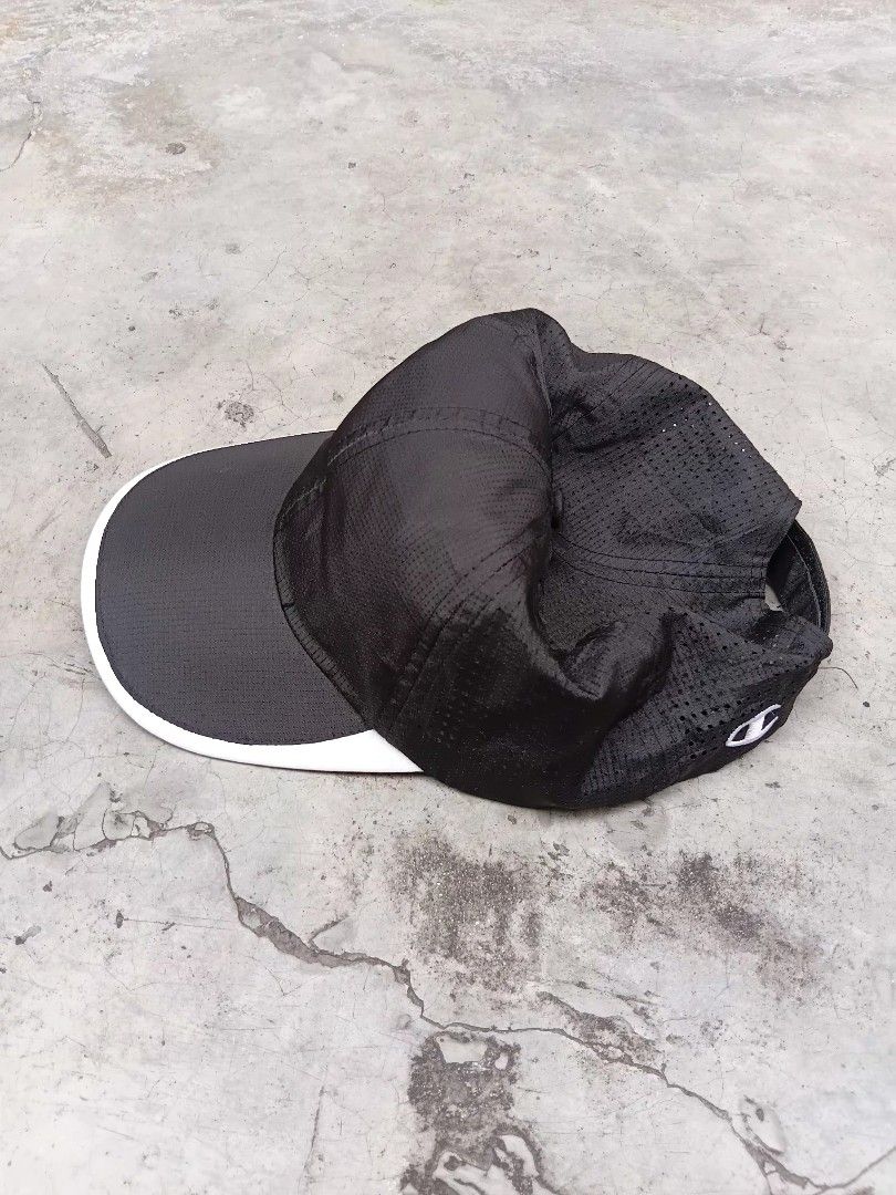 Champion Performance Breathable Running Cap. (Category: Activewear) located in Manila. Submitted by hustler_777 (Listing ID 1445566938, Image 2). Description: Front Panels: Features a smooth, lightweight ripstop performance nylon front panel designed to block wind and light drizzle. Visor Accent: The distinct white sandwich trim wrap around the edge of the dark grey brim provides a sporty, high-contrast look. Top/Back Ventilation: The mesh breath